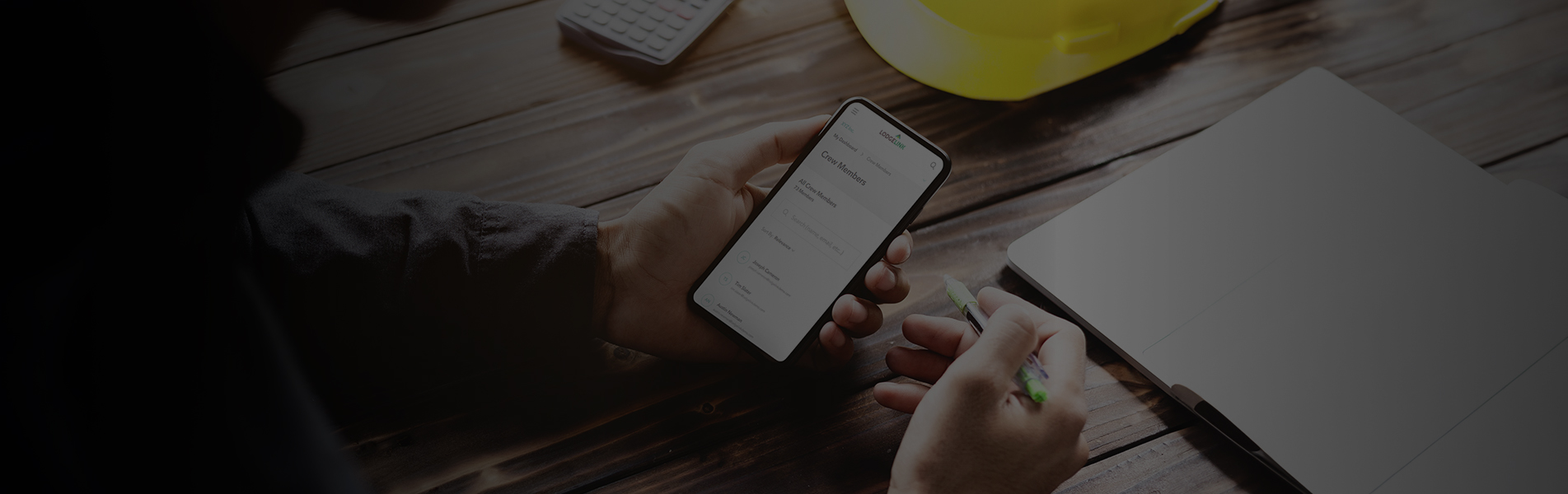  A person using a mobile device to manage workforce travel bookings, with digital booking and invoice overlays.