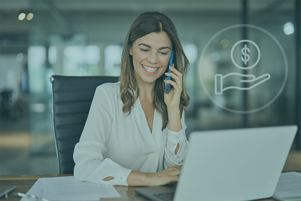 Business professional smiling while discussing negotiated hotel rates with LodgeLink platform on laptop.