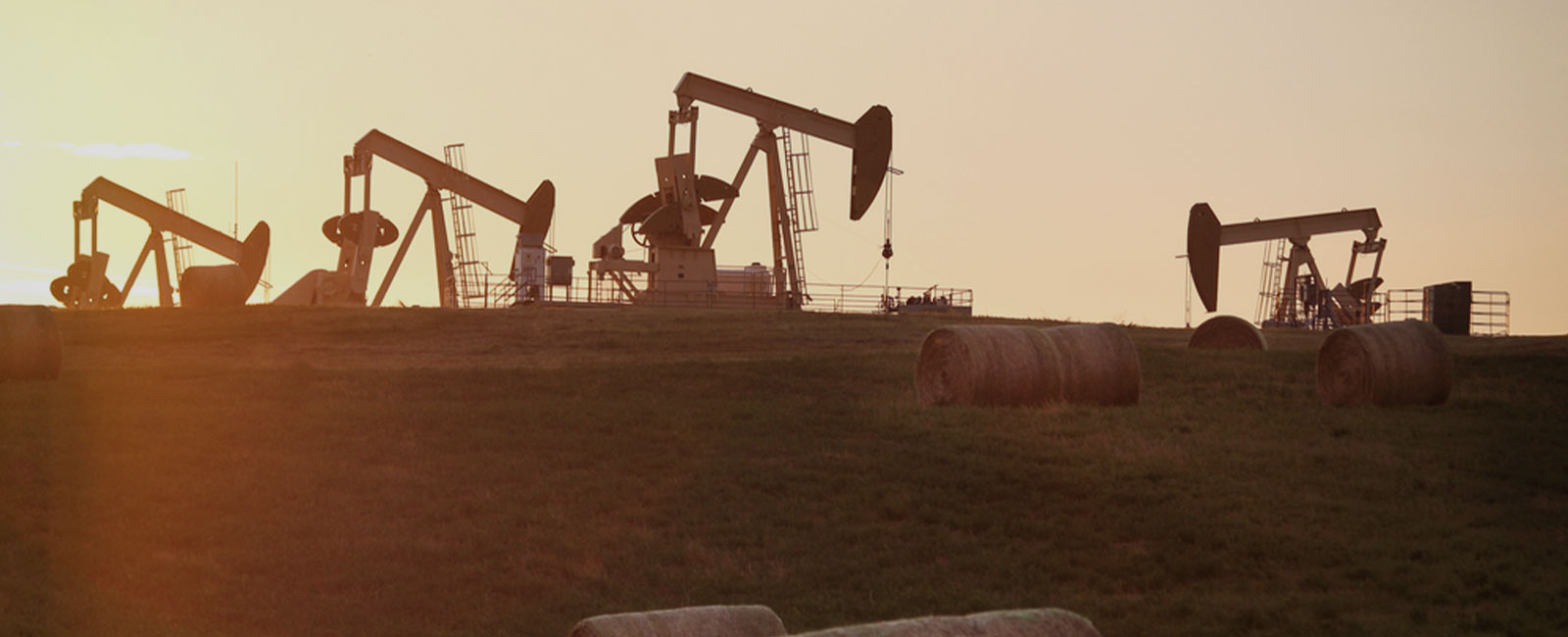 A silhouette of oil rigs
