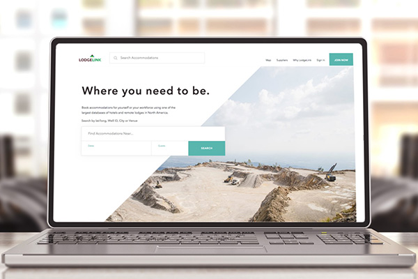 A computer with LodgeLinks workforce travel site on the screen