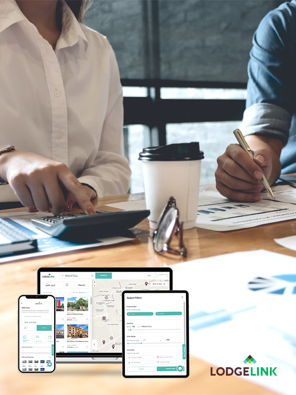 Two people working in the background with a snapshot of LodgeLink's platform.