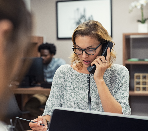 A person on the phone. 