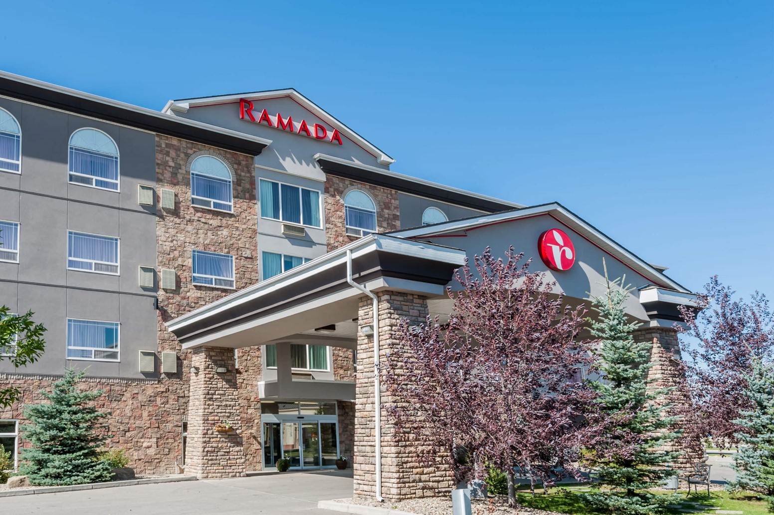 An outside view of Ramada High River Hotel in High River, Alberta.
