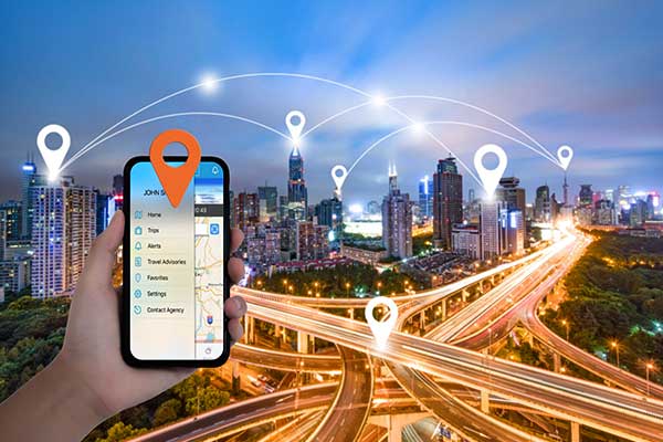 a hand holding a smartphone with a map of a city on it.	