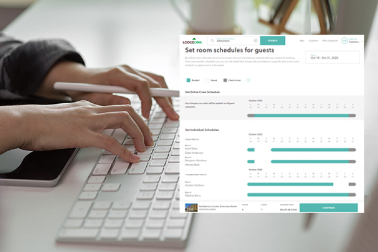 A person typing on a keyboard with a room schedule for guests screen 