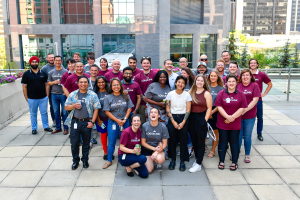 A group LodgeLink employees standing together for a photo