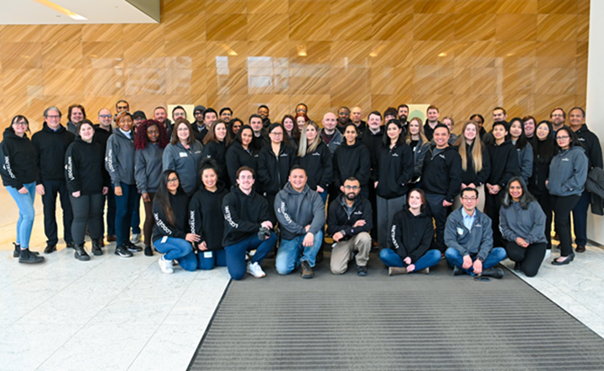 A group of LodgeLink employees posing for a photo