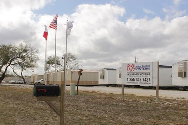 A row of flags in front of a modular spaces