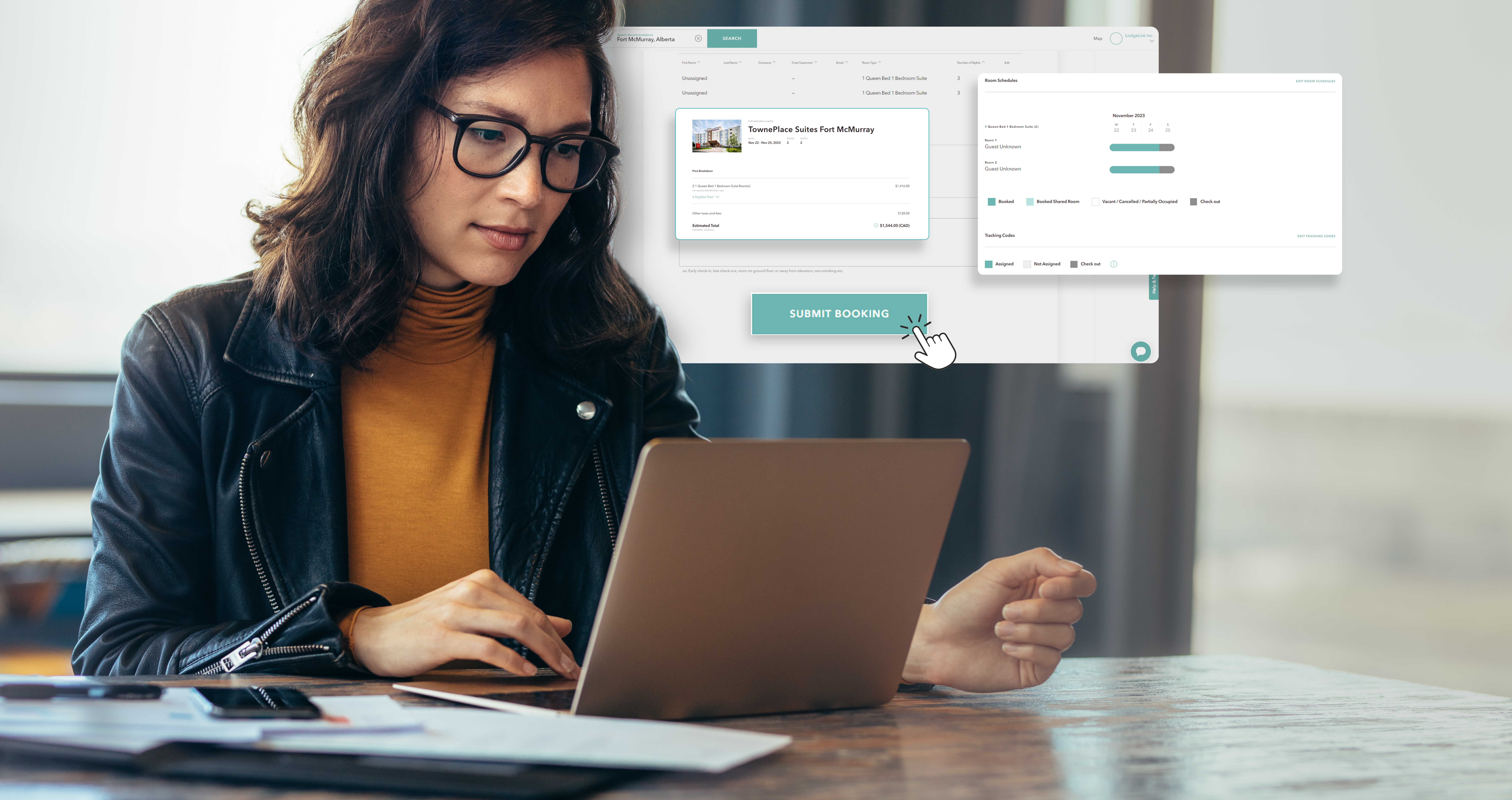 A person sitting at a table using a computer on the LodgeLink booking page. 