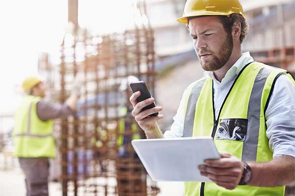 A construction worker on the phone.