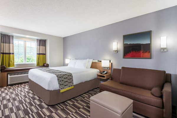 A bedroom view inside Microtel Inn & Suites New Martinsville.