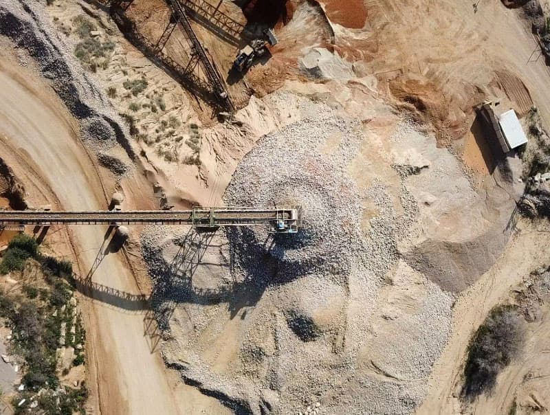 an aerial view of an open pit mine showing sustainable mining.