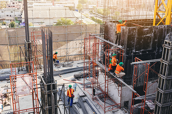 A group of construction workers on a construction site.