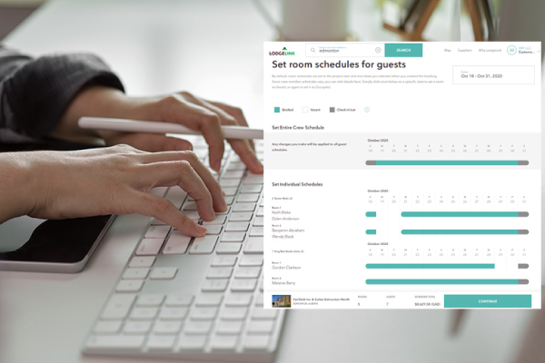 A person typing on a keyboard with a room schedule for guests screen 